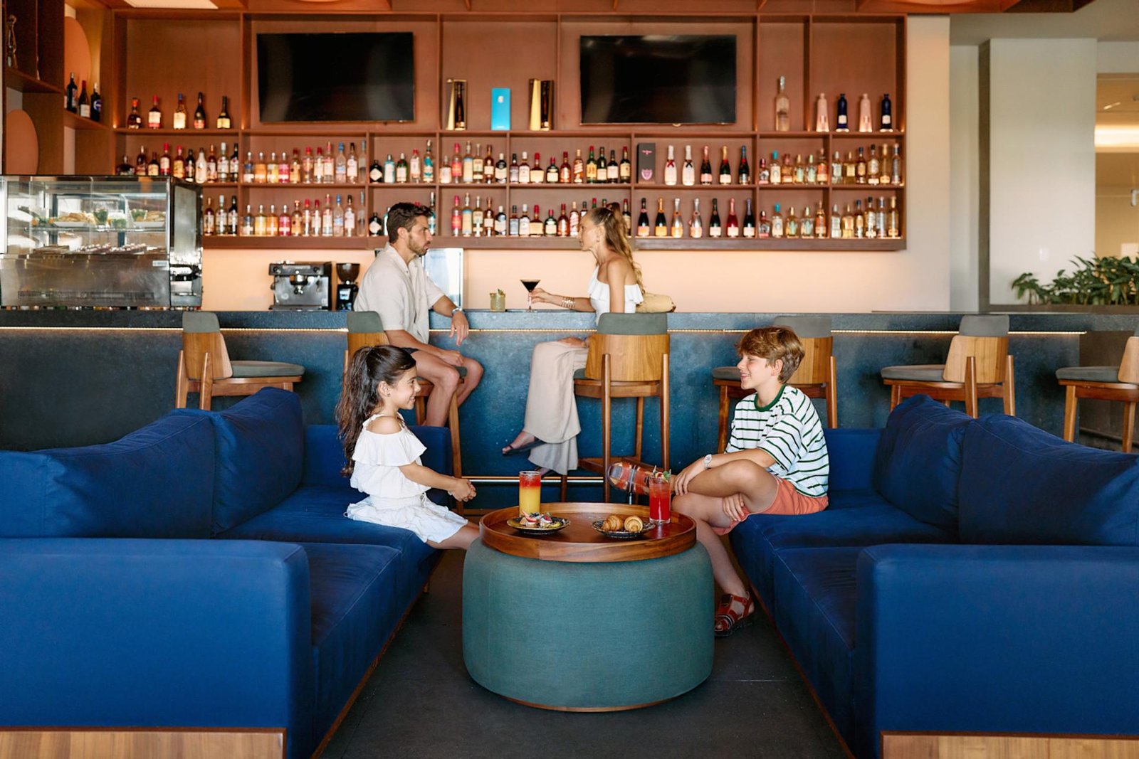 Couple checking in to a luxury hotel lobby