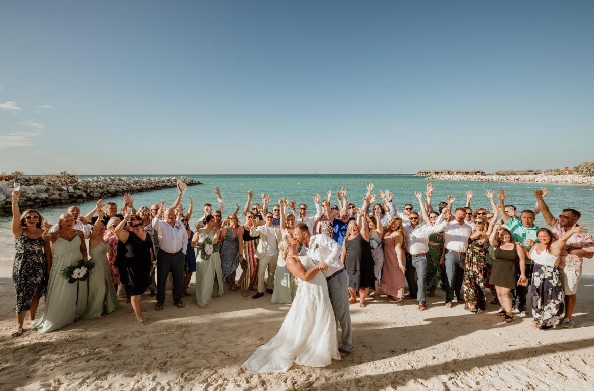 Bride and groom with guests at destination wedding